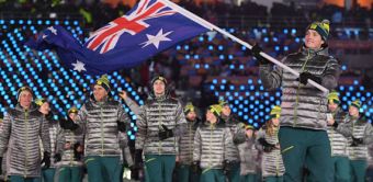 Scott James carries the Australian flag at the Winter Olympic Games opening ceremony